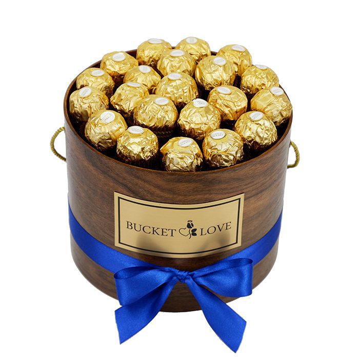 ferrero roche box of chocolate in a wodden brown box with blue bow
