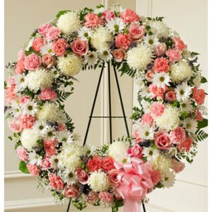 Sympathy wreath in pink and white colours