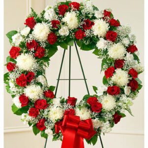 Sympathy wreath in white and red colours