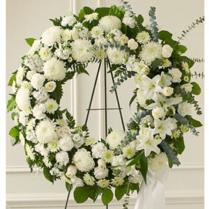 Sympathy flower arrangement in white